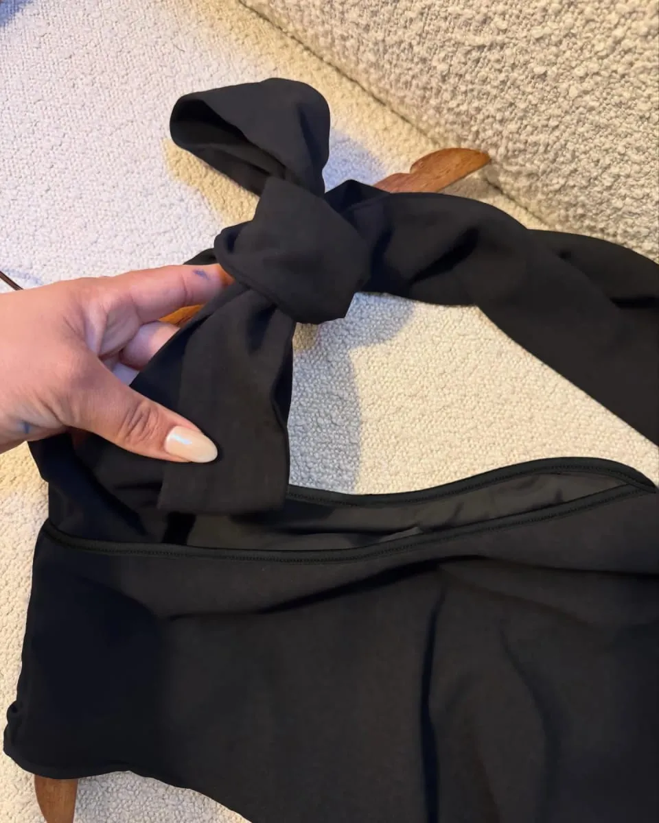 A Black One-Shoulder Halter-Neck Dress with a Bow Pleated and Fitted Short Dress Perfect for Everyday Outings and Attracting Attention a Sexy Little Black Dress for Dates — image 4